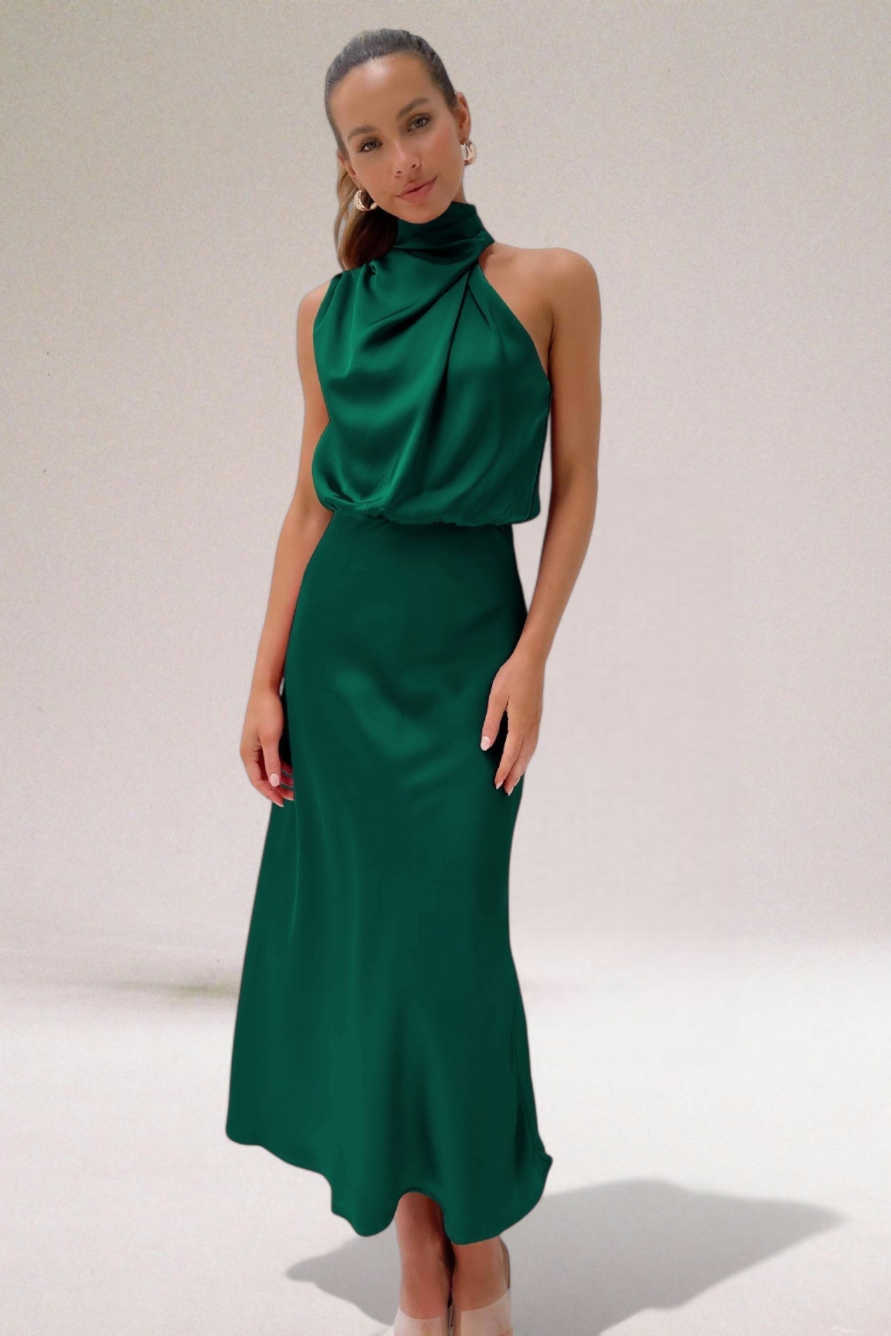 Elegant black halter neck dress with sleek silhouette and radiant finish for special occasions