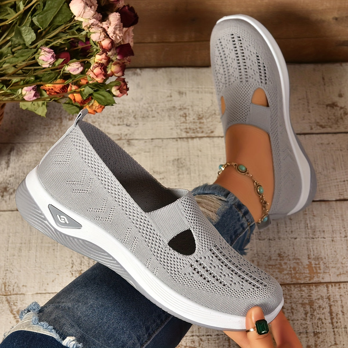 Women's slip-on knit shoes in neutral tones, lightweight breathable mesh upper with supportive rubber sole