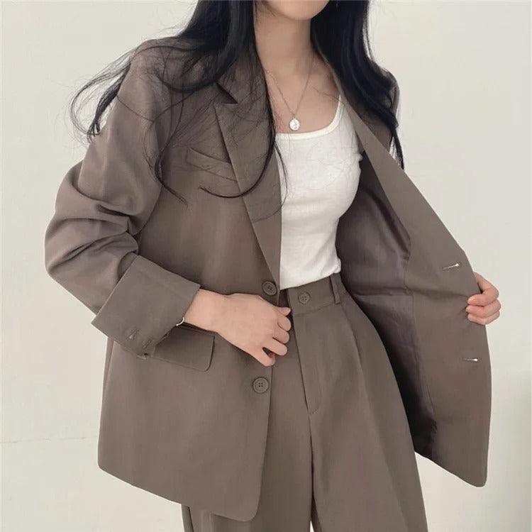Women's tailored long blazer suit set with high-waisted trousers, structured fit for professional elegance