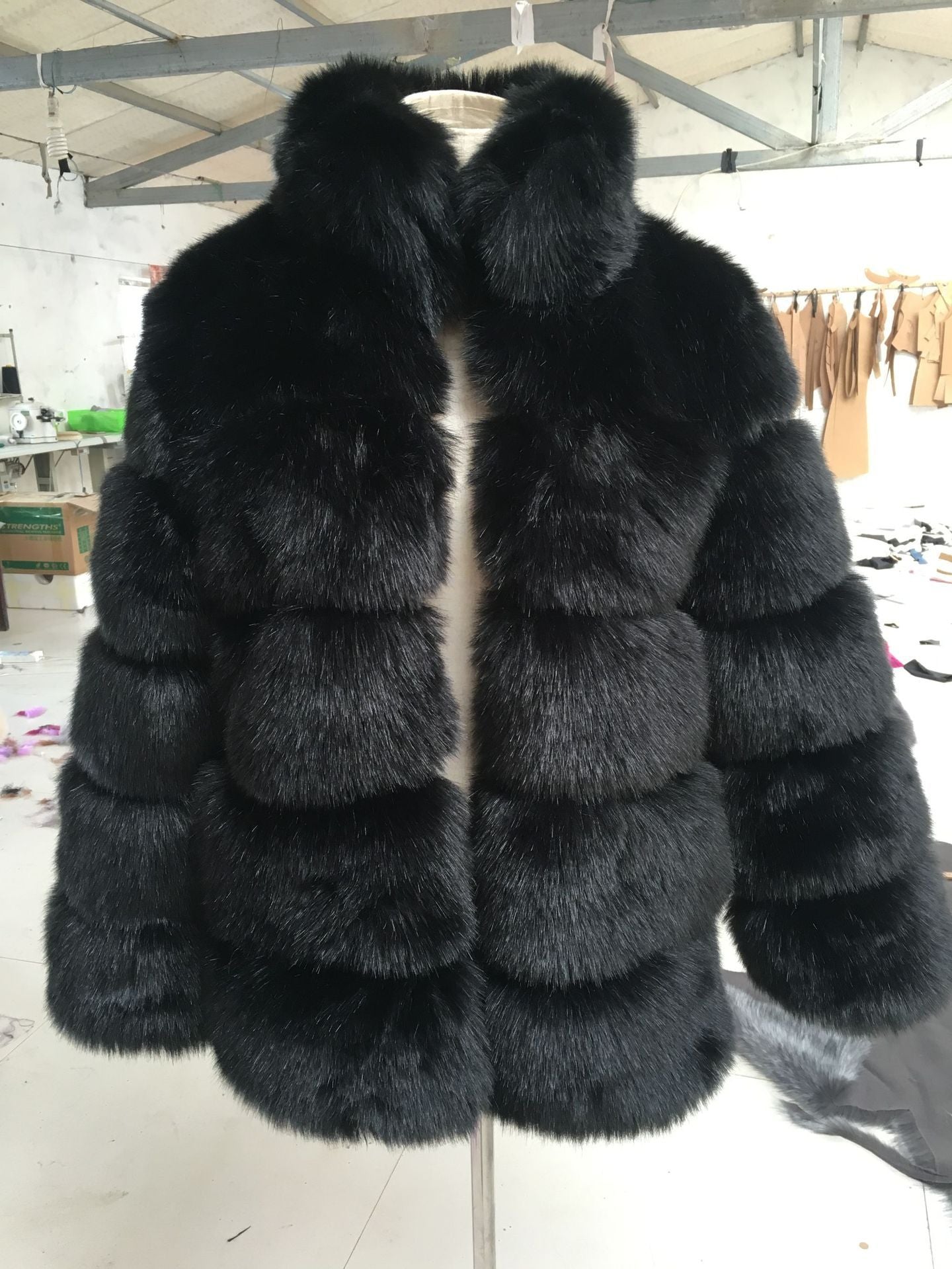 Short unisex faux fox fur coat in plush neutral tones, modern minimalist silhouette with luxe texture