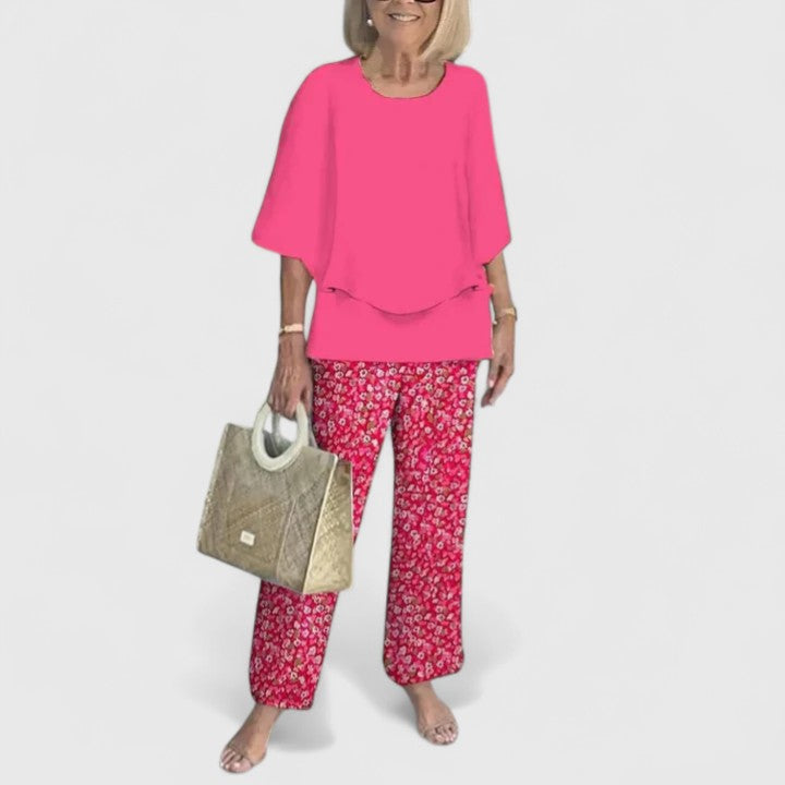 Sage green floral two-piece set with relaxed layered top and wide-leg botanical print pants