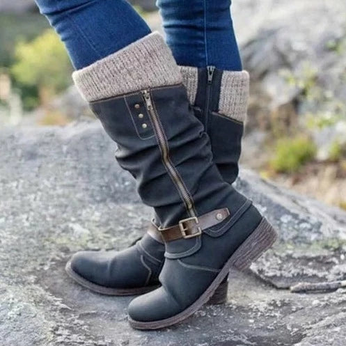 Black knee-high boots with buckle strap accent and soft knit cuff for autumn winter style