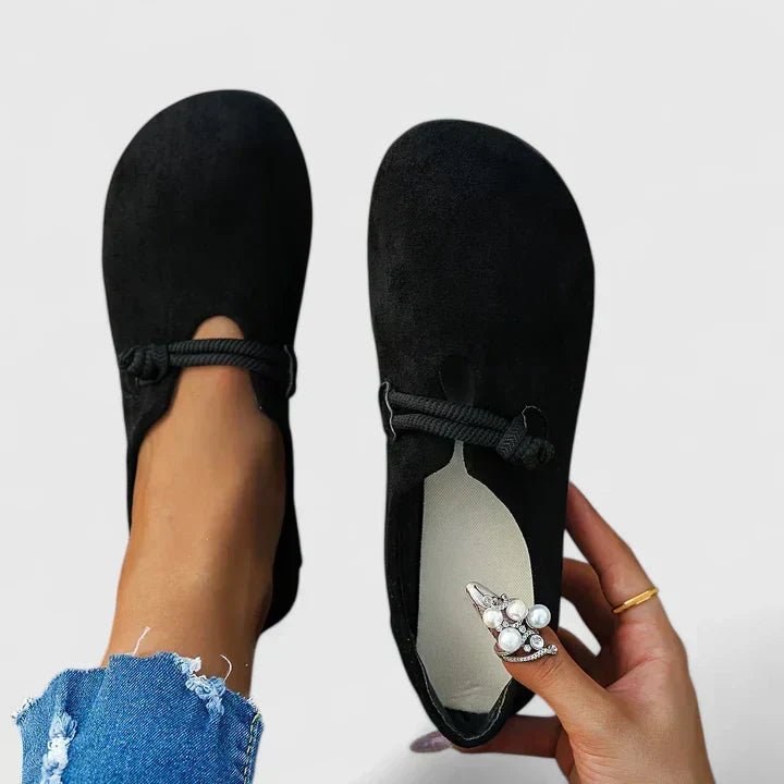 Women's tan comfort loafers with cushioned footbed, ergonomic sole, and sleek timeless silhouette