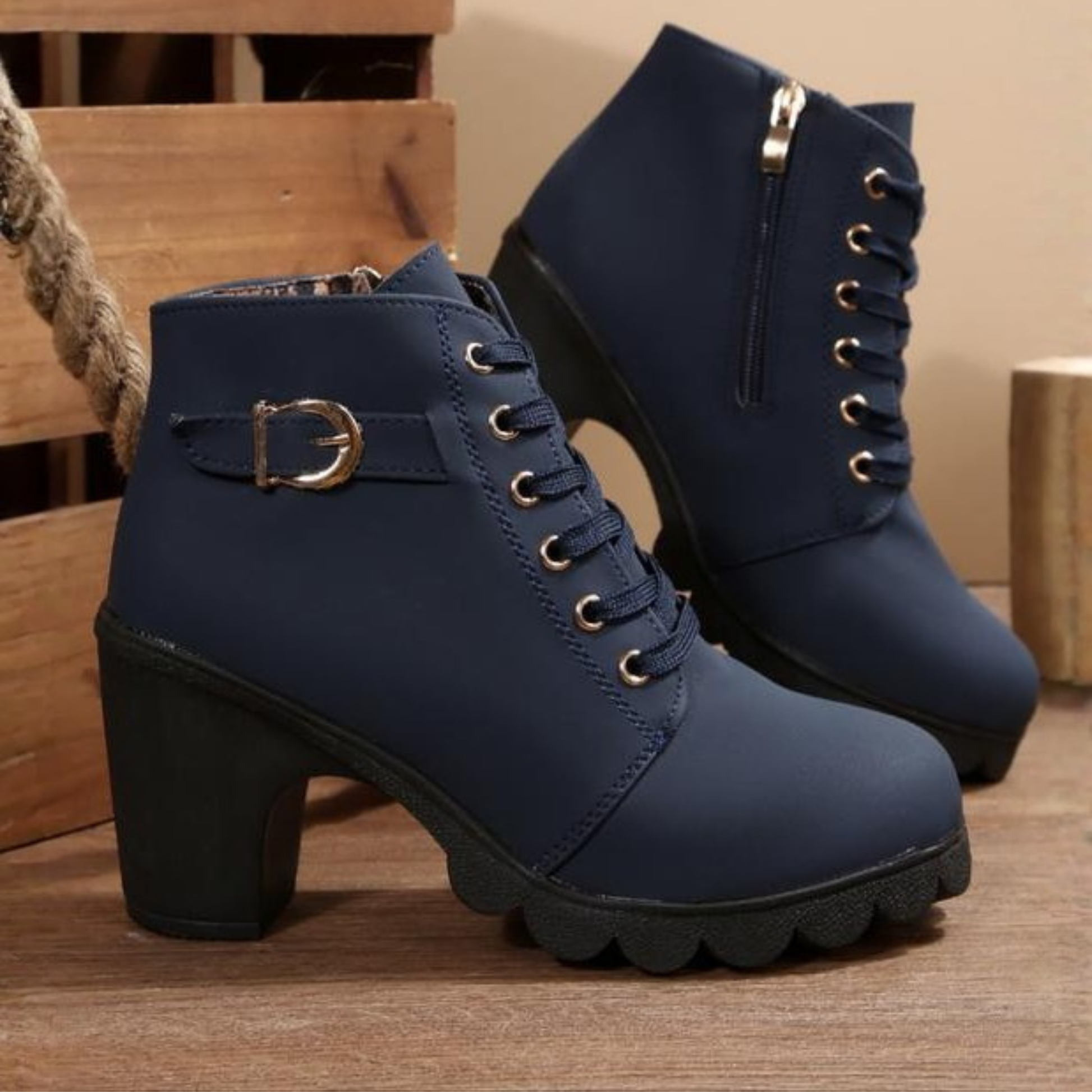 Black chunky ankle boots with lace-up design, sturdy sole, and bold fashion-forward silhouette