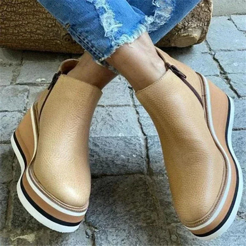 Women's black platform wedge ankle boots with cushioned footbed and elevated stable sole