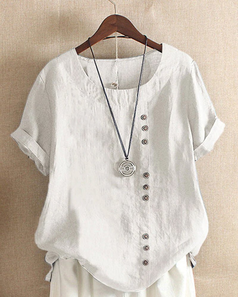 Women's relaxed linen top with crew neck, button front placket, cuffed short sleeves, and curved hem