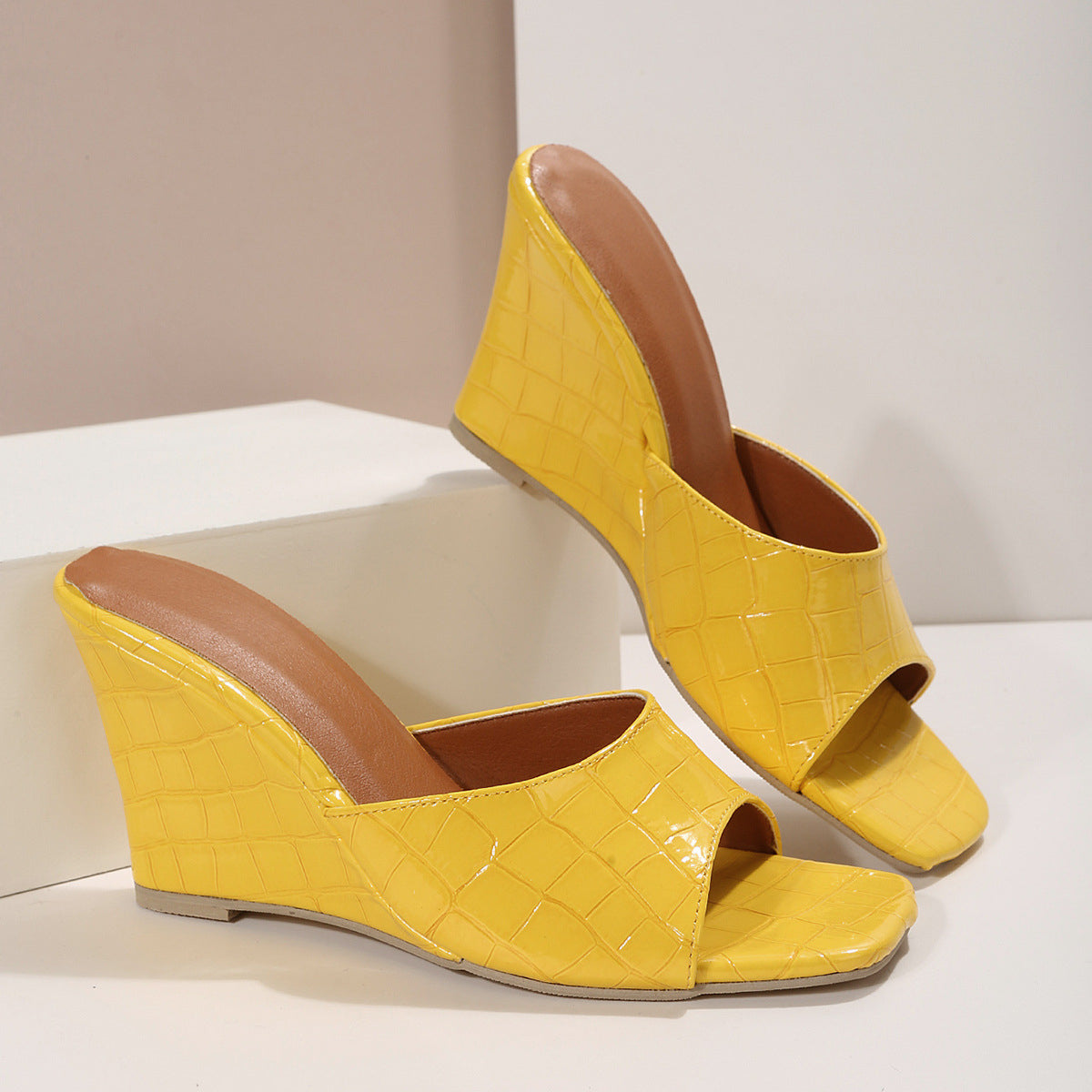 Women's faux snakeskin leather wedge shoes with cushioned sole and bold textured finish