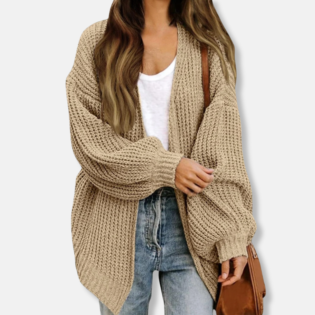 Women's oversized knit cardigan with lantern sleeves tapering to ribbed cuffs for refined layering