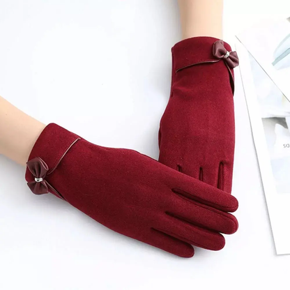 Black touchscreen winter gloves with elegant bow detail and flexible split-finger design