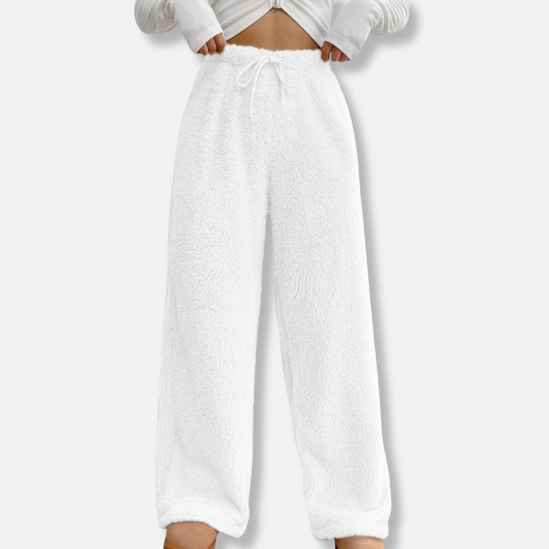 Women's plush fleece lounge pants in loose wide-leg fit with adjustable drawstring waist