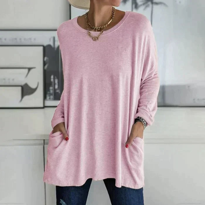 Women's ruby red oversized long sleeve tunic top with front pockets and flared hem