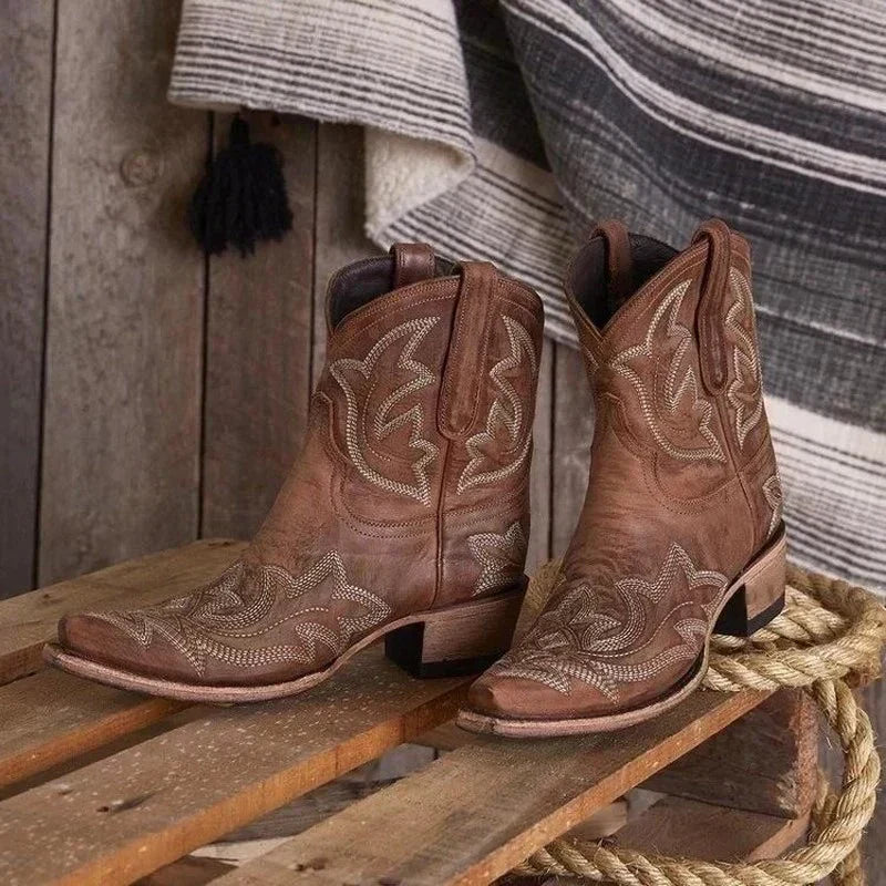 Women's western cowboy boots with intricate floral embroidery, pointed toe, classic bold silhouette