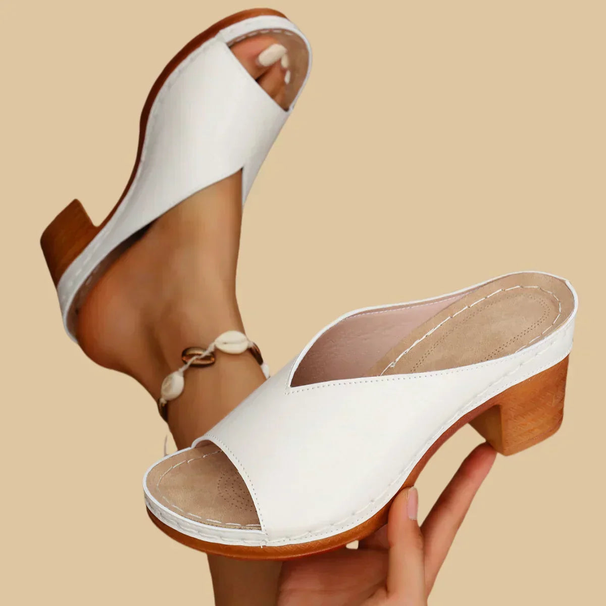 Women's beige comfort flat sandals with contoured ergonomic footbed and thick balanced heel support