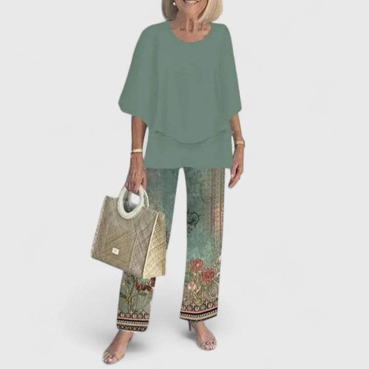 Sage green floral two-piece set with relaxed layered top and wide-leg botanical print pants
