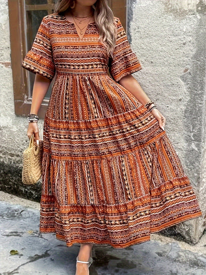 Women's boho flowy draped dress in ethnic print, loose feminine silhouette with flowing fabric