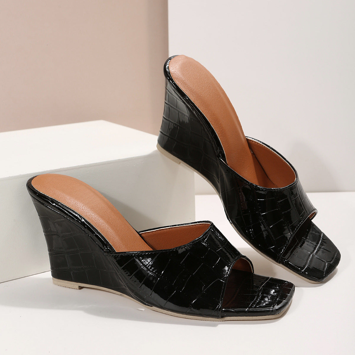 Women's faux snakeskin leather wedge shoes in neutral tone with cushioned sole and bold textured finish