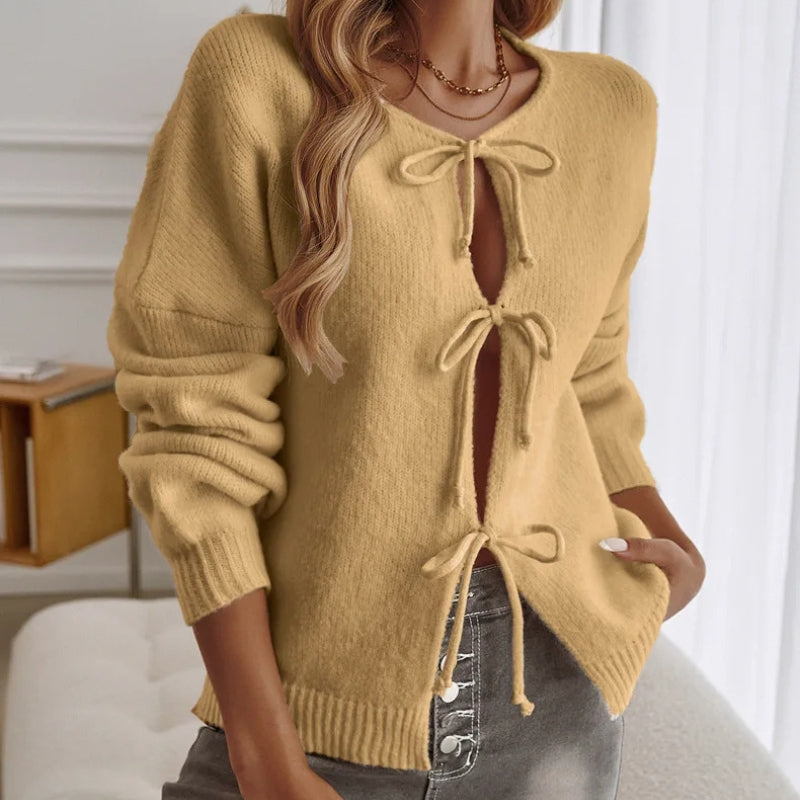 Pink boho knit cardigan with lace-up front detail, relaxed fit, and long sleeves for cozy layering