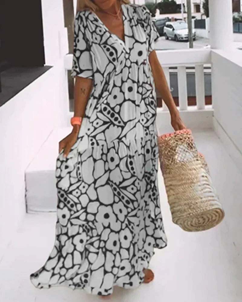 Flowy white A-line summer dress with breathable lightweight fabric and flattering relaxed silhouette