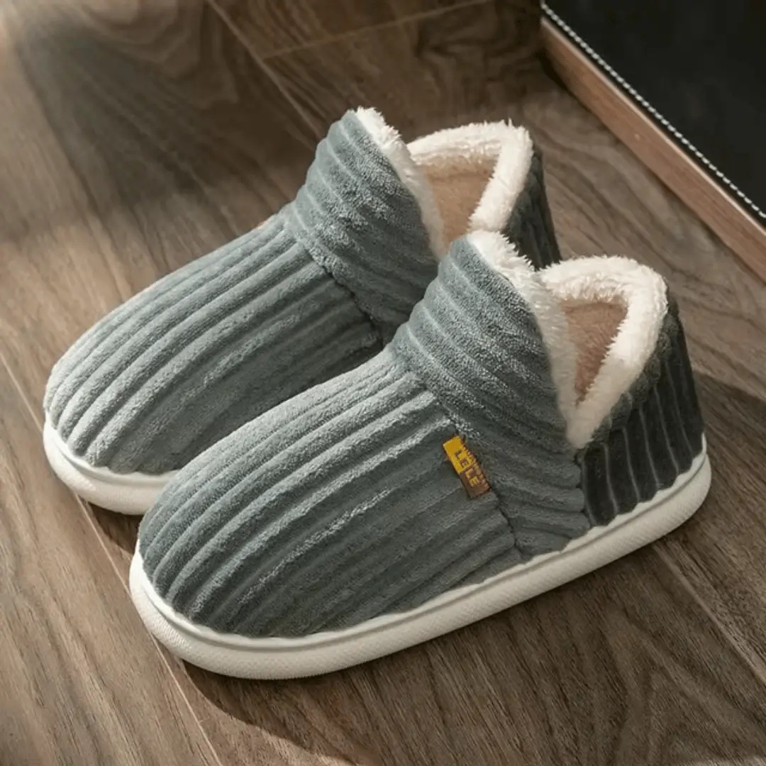 Cozy slip-on sherpa fleece slippers with plush lining and non-slip rubber sole for indoor comfort