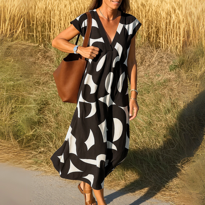 Women's flowy V-neck draped evening dress with elegant fluid silhouette and flattering neckline