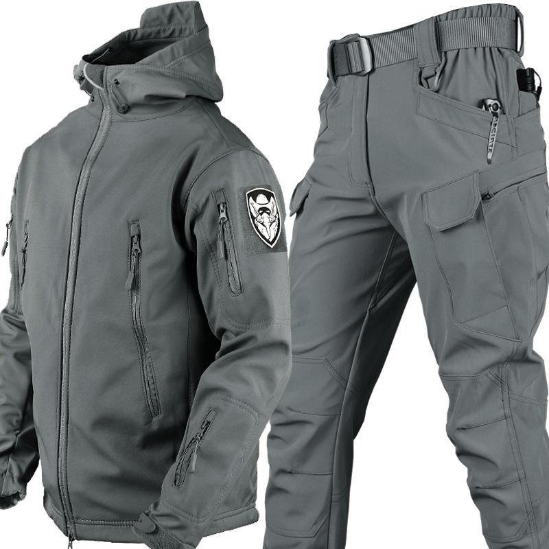 Men's gray softshell two-piece outdoor suit with windproof jacket, utility pockets, and adjustable fit