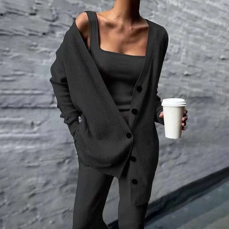 Women's oversized long rib-knit cardigan with button closure and side pockets, relaxed longline fit