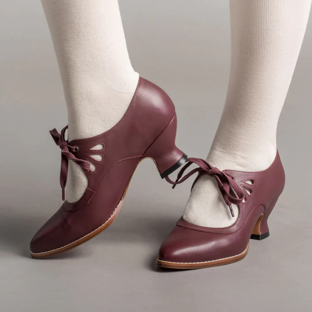 Vintage pin-up stiletto heels with ankle strap, retro silhouette in classic two-tone design