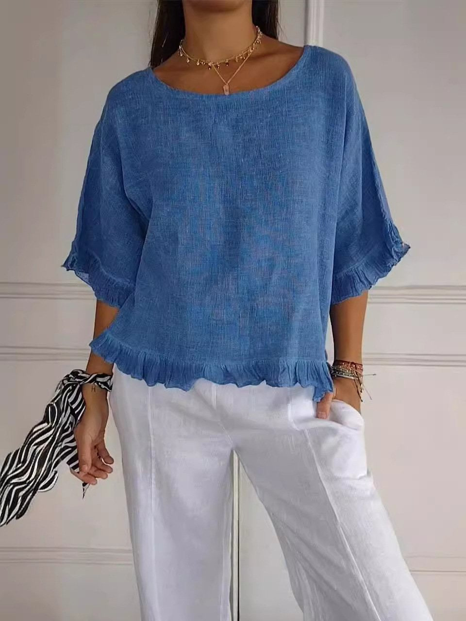 Soft blue lightweight women's blouse with minimalist cut and casual elegant silhouette
