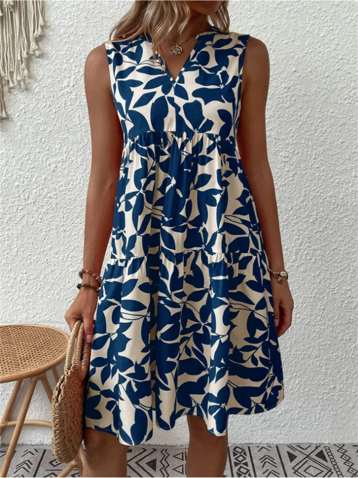 Flowy floral midi dress with elegant drape, waist-defining silhouette, and airy feminine cut