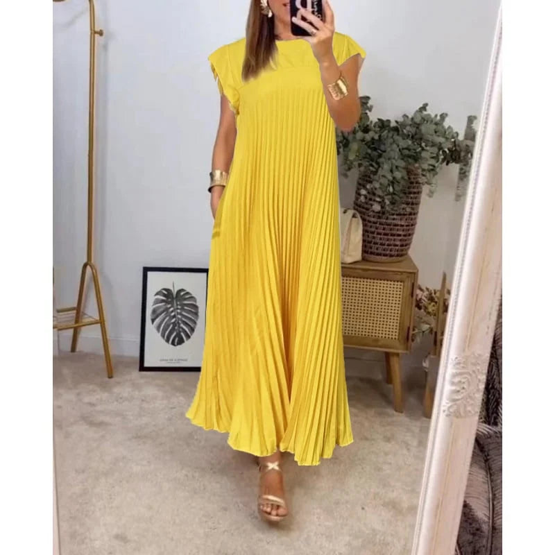 Women's flowy pleated maxi dress in elegant cocktail style with graceful elongating silhouette