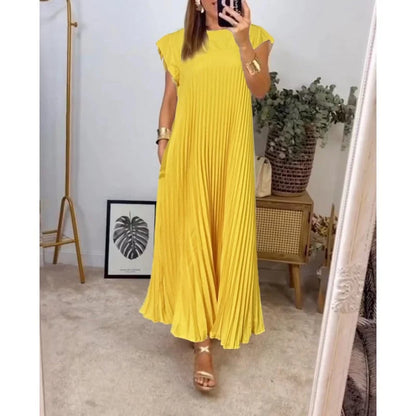 Women's flowy pleated maxi dress in elegant cocktail style with graceful elongating silhouette