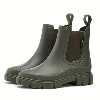 Women's black waterproof slip-on Chelsea boots with elastic side panels, sleek minimalist design