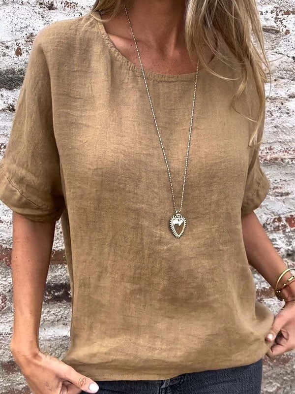 Cream minimalist relaxed top with clean silhouette and subtle structure for effortless everyday elegance
