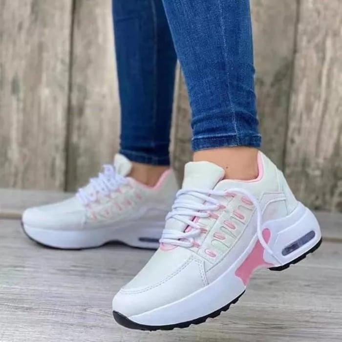 Women's chunky platform sneaker in white with gold-accented midsole, lace-up closure, and mesh upper