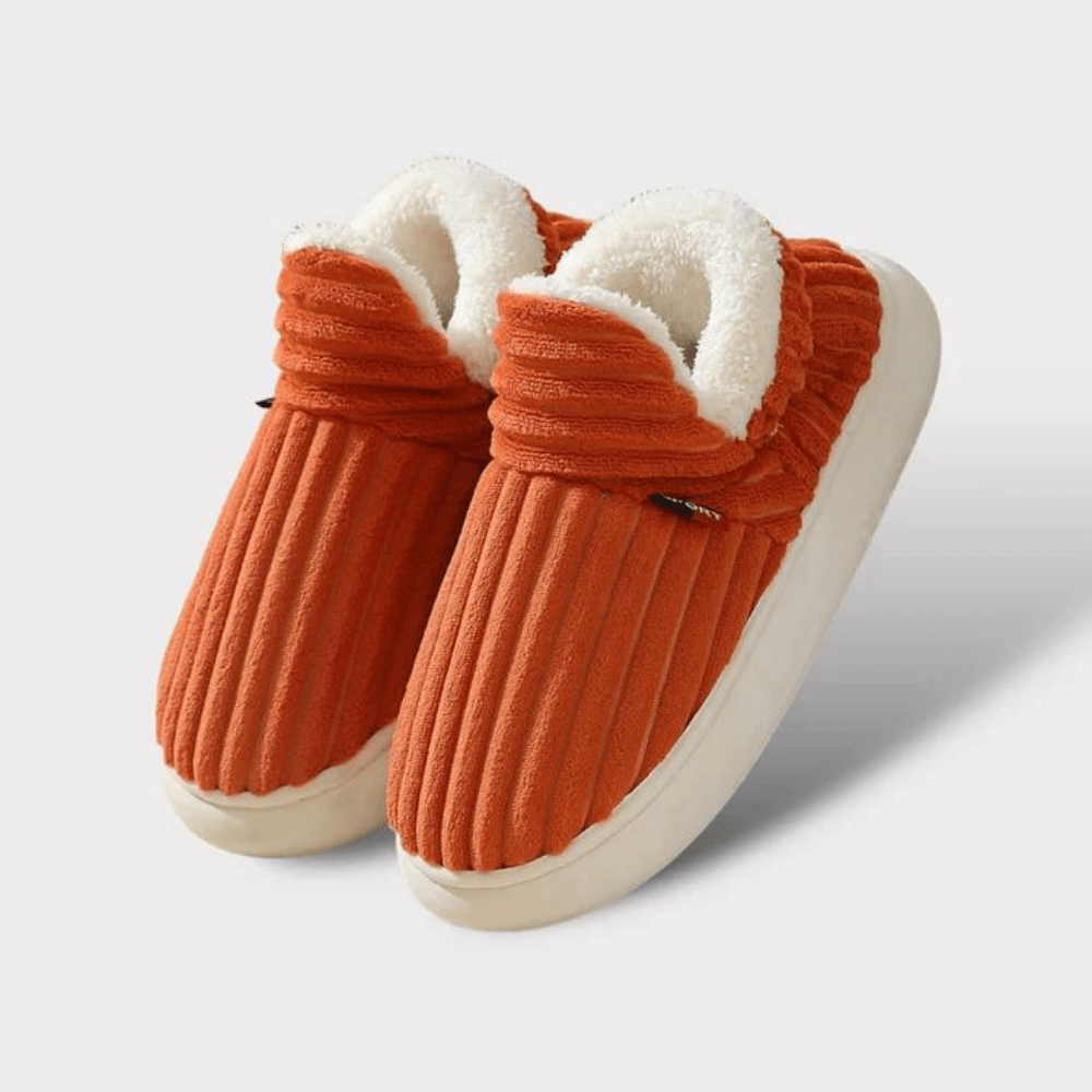 CloudCush ultra-cozy plush slippers in neutral tones with cushioned sole for all-day indoor warmth