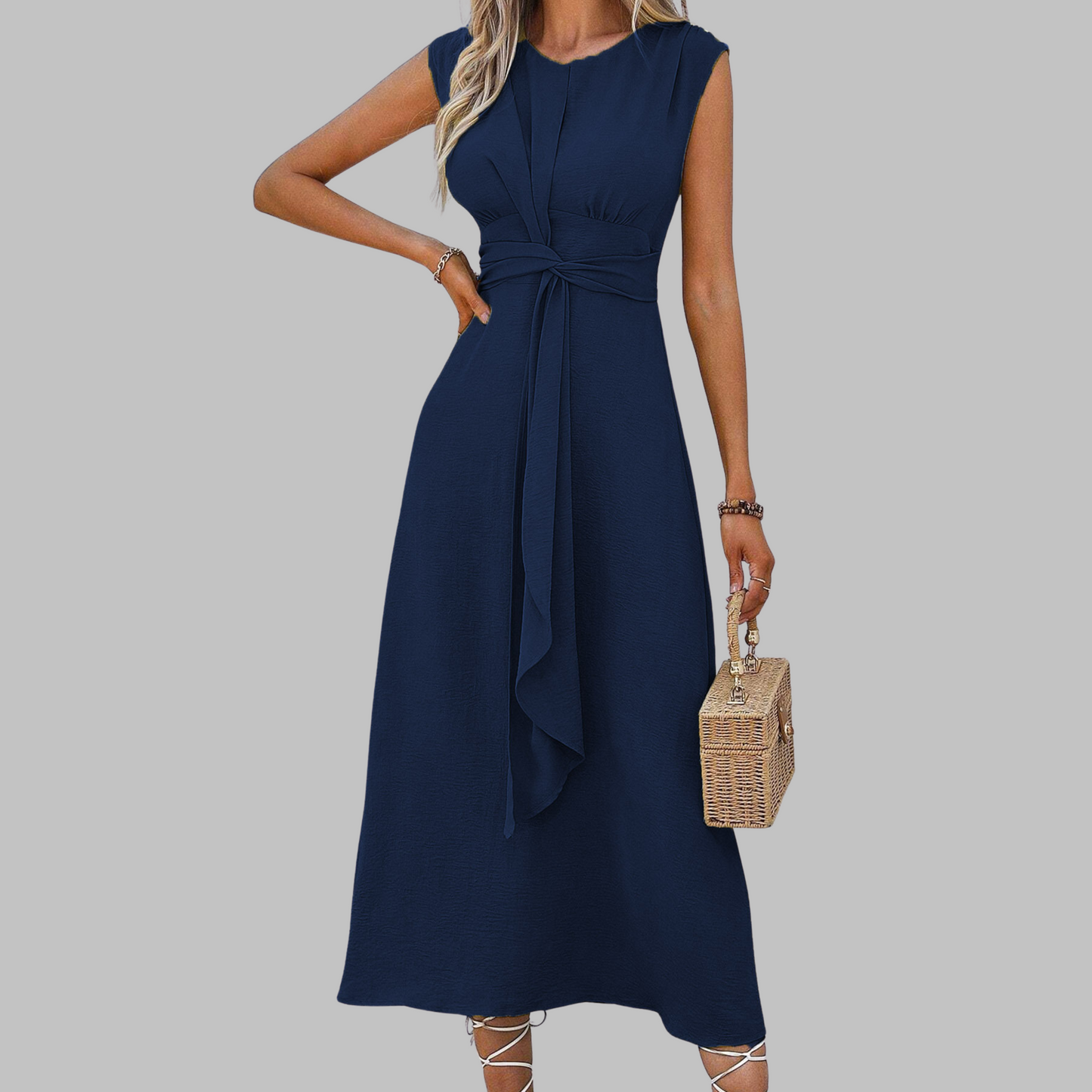 Elegant sleeveless black maxi dress with flattering round neckline and graceful flowing silhouette