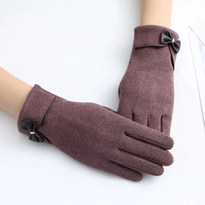 Black touchscreen winter gloves with elegant bow detail and flexible split-finger design