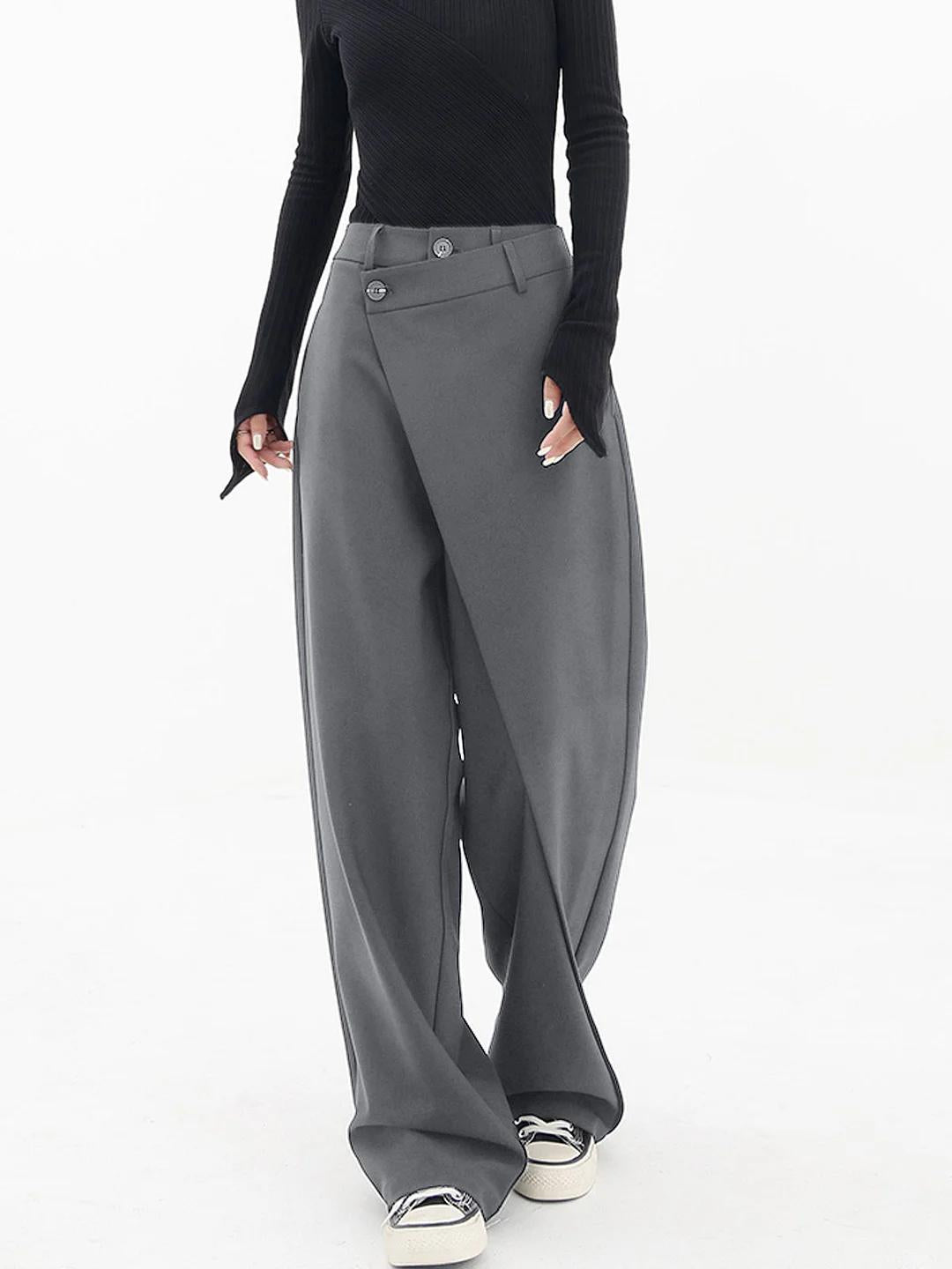 Black modern baggy trousers with asymmetric waistband for a slim defined silhouette