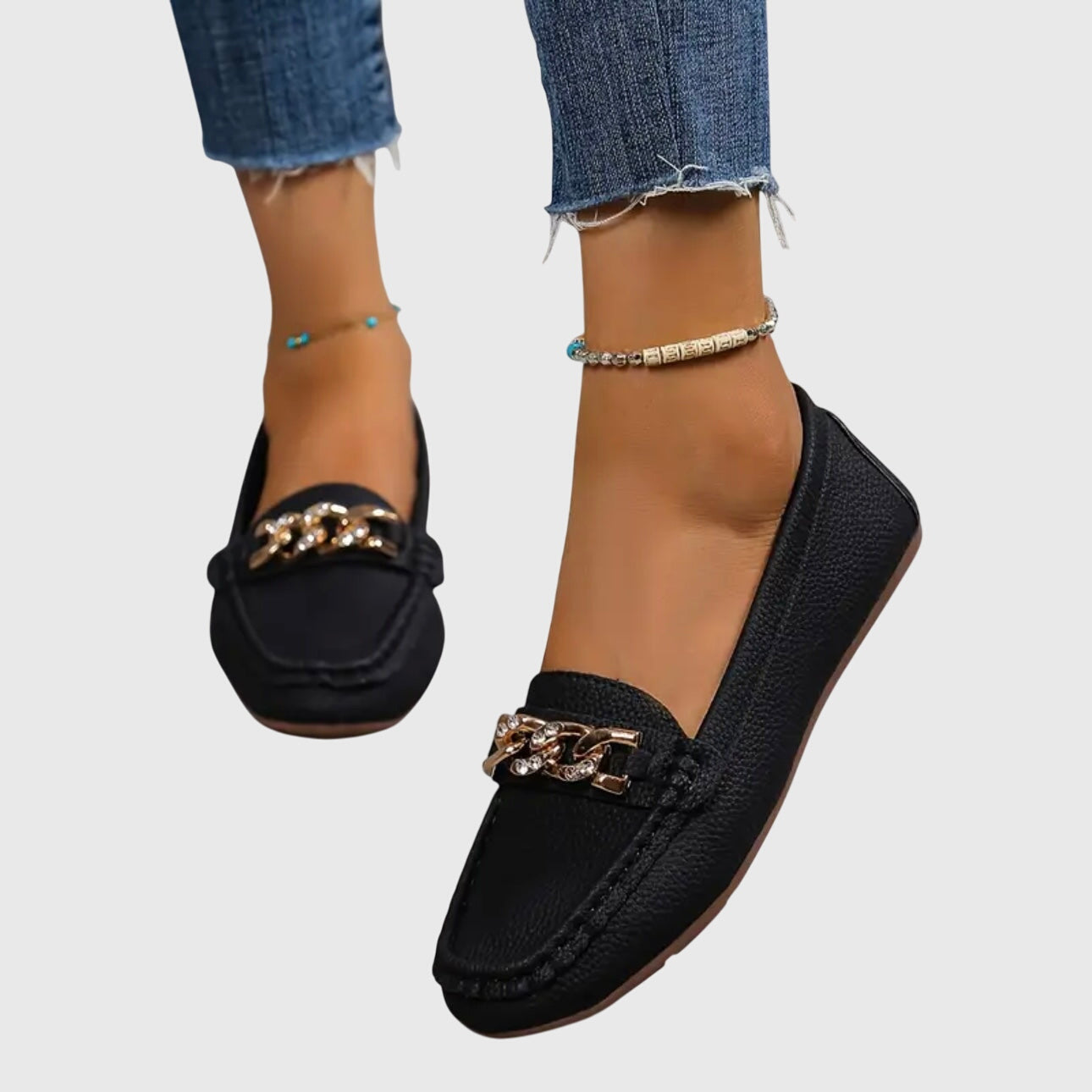 White women's slip-on flat loafers with chunky gold chain hardware accent, casual chic style