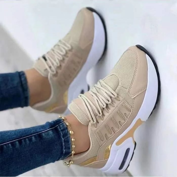 Women's chunky platform sneakers in white with gold-accented midsole, lace-up closure, and breathable mesh upper