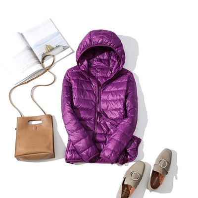 Women's short quilted puffer jacket front zip closure lightweight warm winter coat sleek silhouette