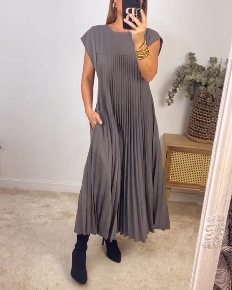 Women's flowy pleated maxi dress in elegant cocktail style with graceful draped silhouette