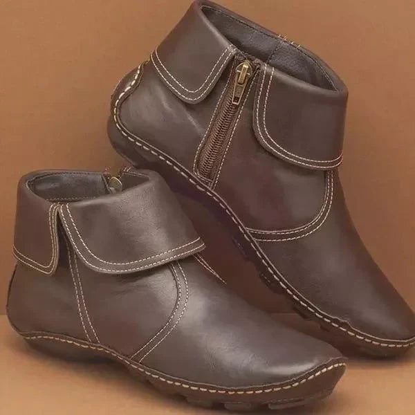 Women's classic black ankle boots with streamlined silhouette and non-slip cushioned sole for all-day comfort
