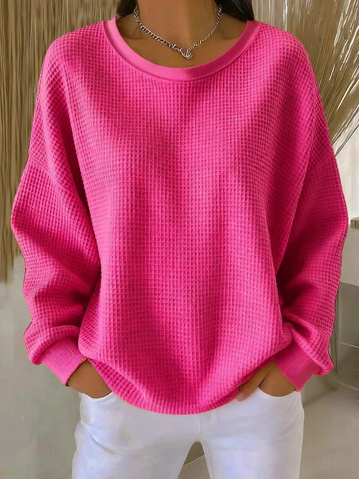Beige textured knit sweater with cozy relaxed fit and subtle dimensional pattern