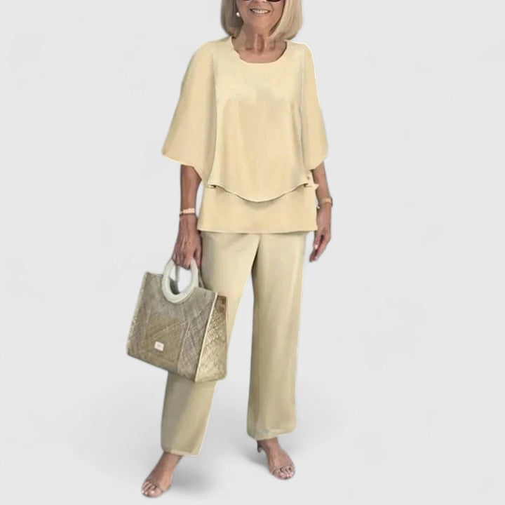 Sage green floral print two-piece set with relaxed layered top and wide-leg botanical pants