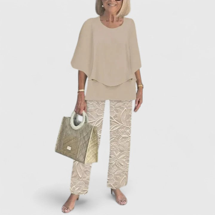 Sage green floral two-piece set with relaxed layered top and wide-leg botanical print pants