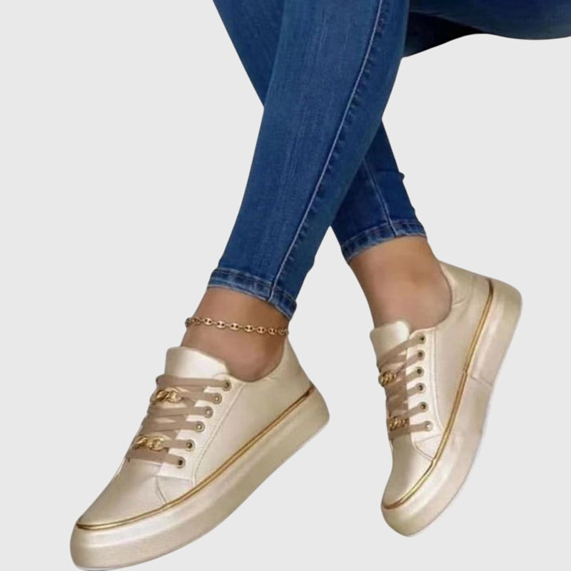 Women's white low-top lace-up sneakers with comfort support cushioning, casual everyday style