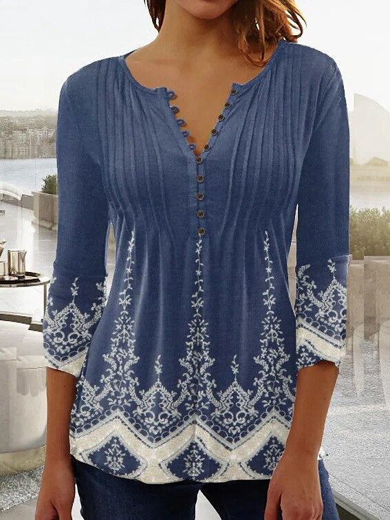 Floral women's blouse with scalloped neckline, flowing pleats, soft feminine everyday elegance style