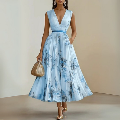 Flowy sleeveless maxi dress in soft drape fabric with flattering V-neck, breezy feminine silhouette