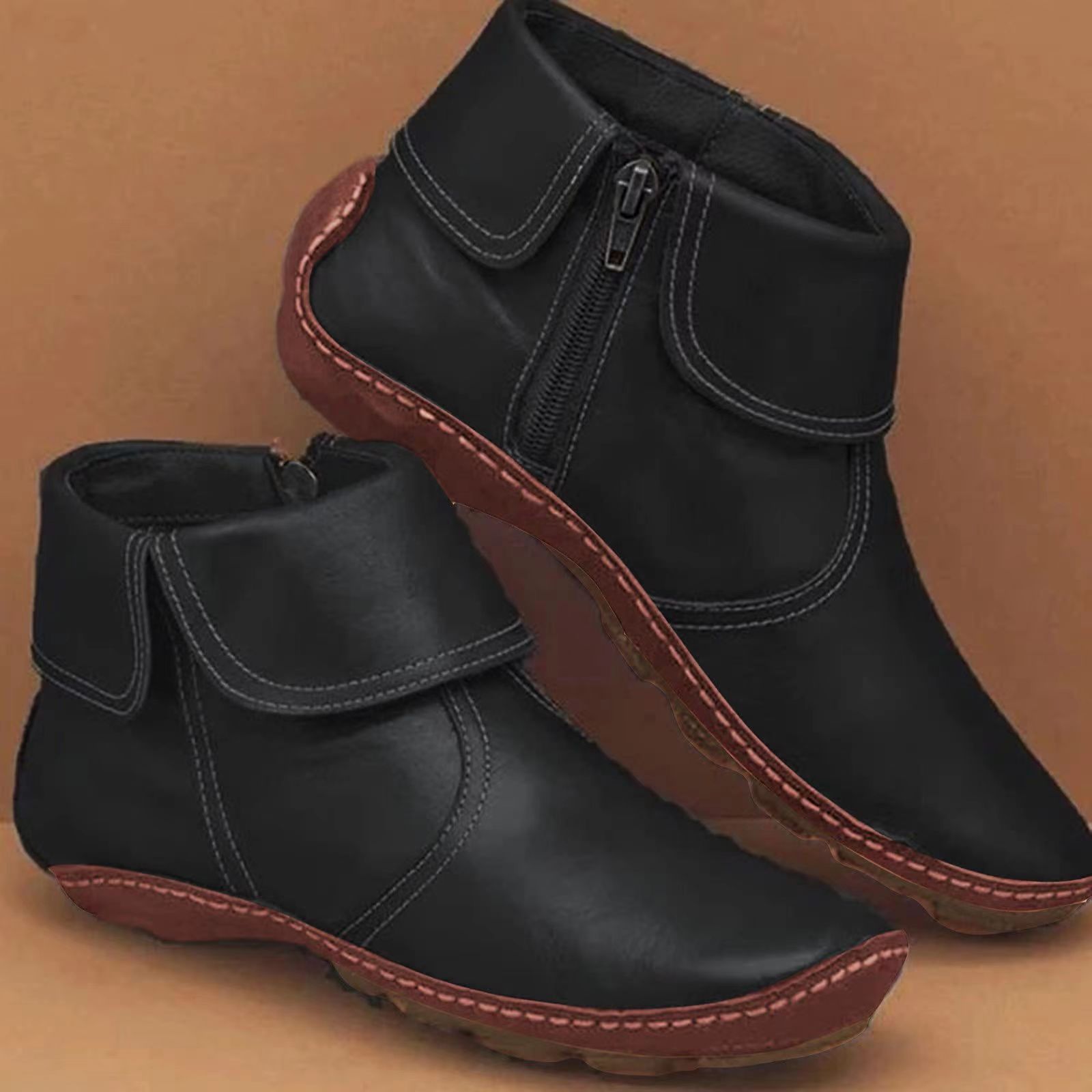 Women's classic black ankle boots with streamlined silhouette and non-slip cushioned sole for all-day comfort